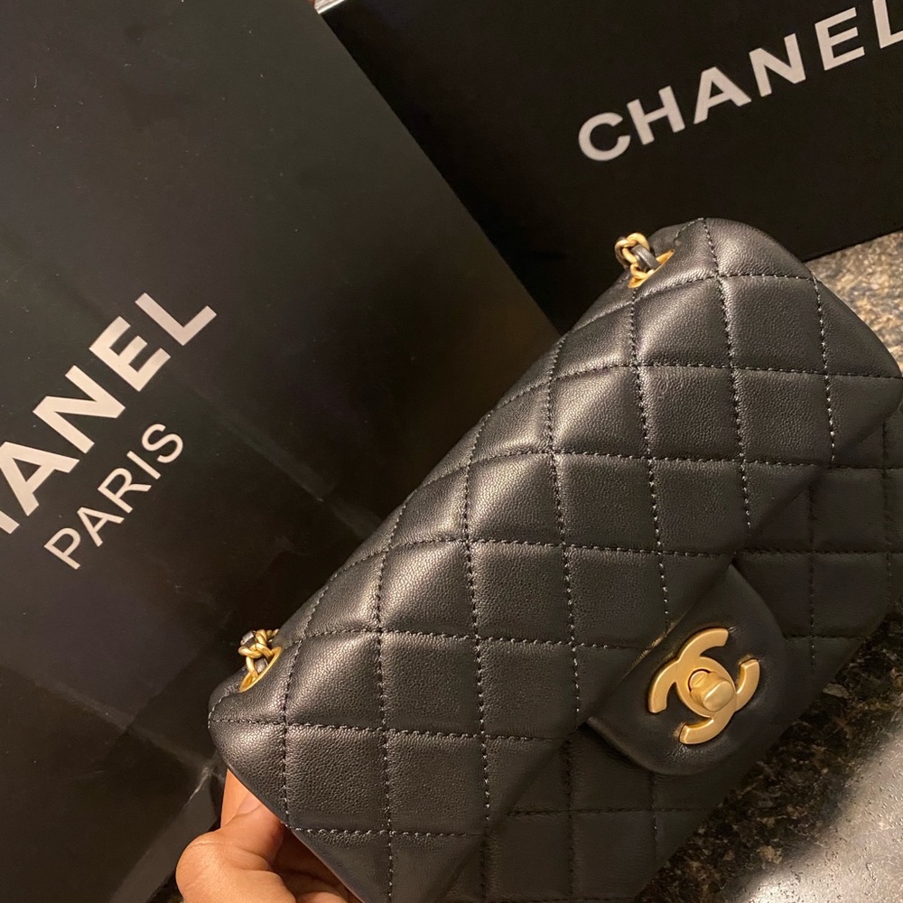 Black CHANEL bag with gold detailing